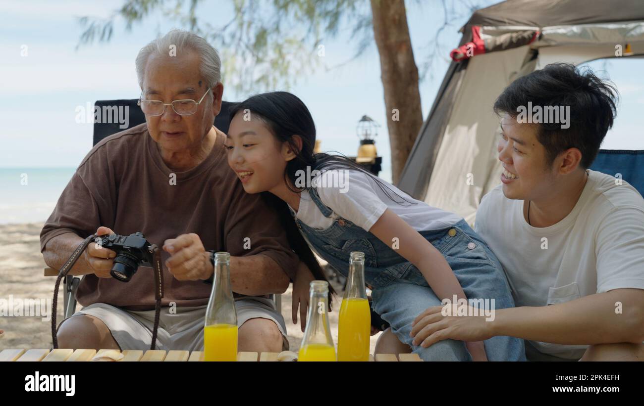 Happy asian family playing at the beach hi-res stock photography and ...