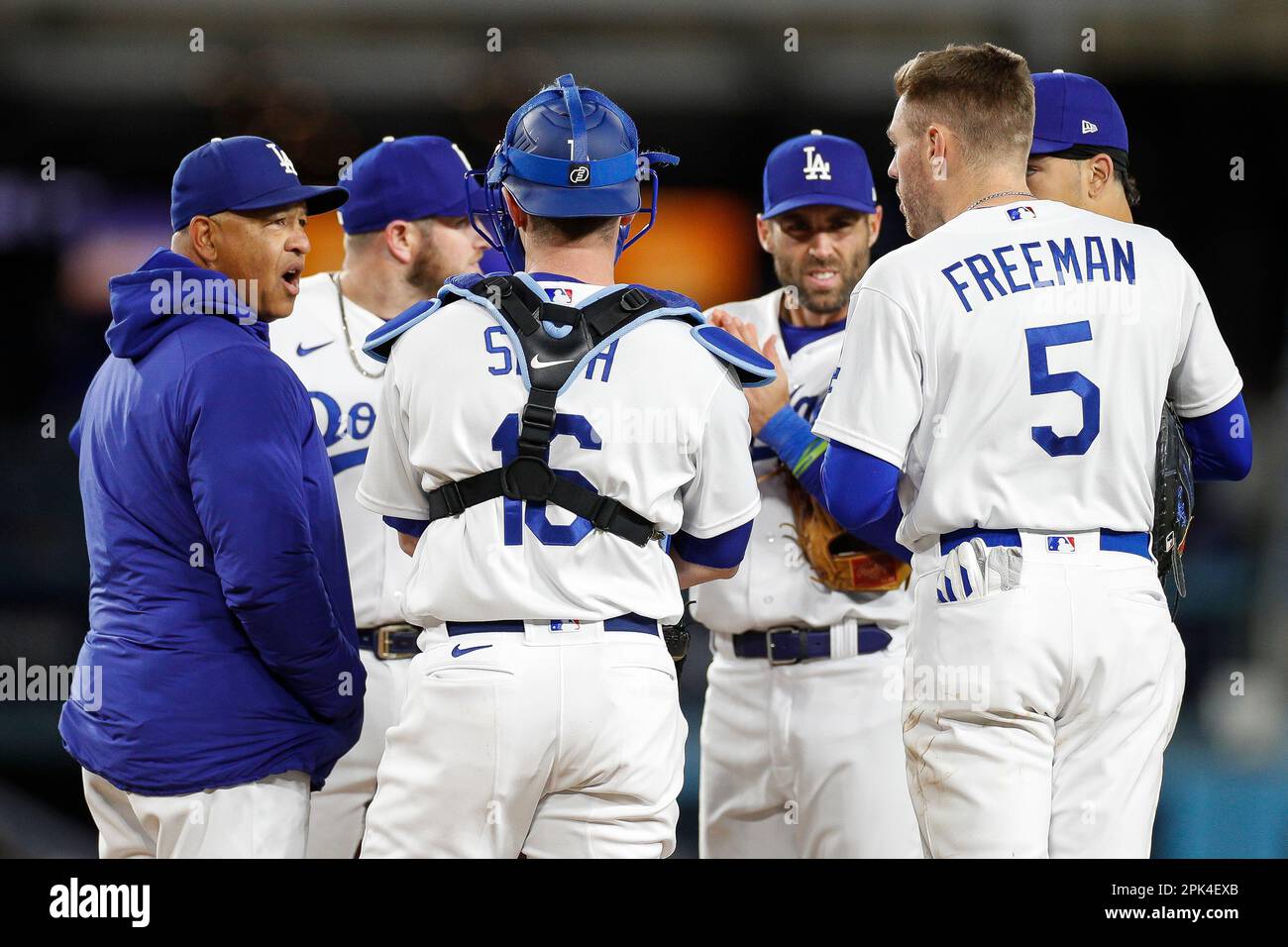 LOS ANGELES, CA - APRIL 03: Los Angeles Dodgers manager Dave Roberts (30),  third baseman Max Muncy (13), catcher Will Smith (16), shortstop Chris  Taylor (3), second basemen Miguel Rojas (11), and