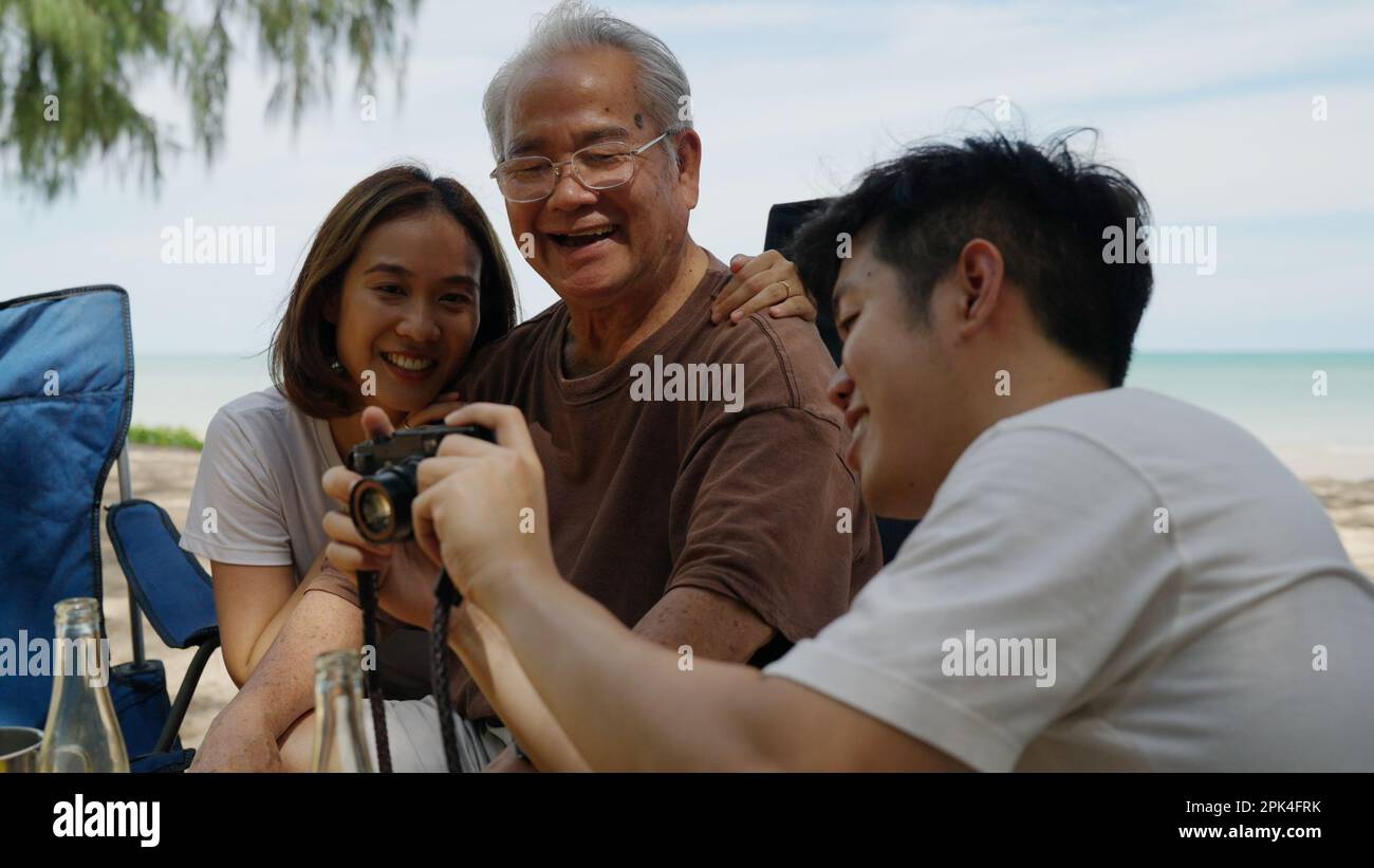 Happy asian family playing at the beach hi-res stock photography and ...