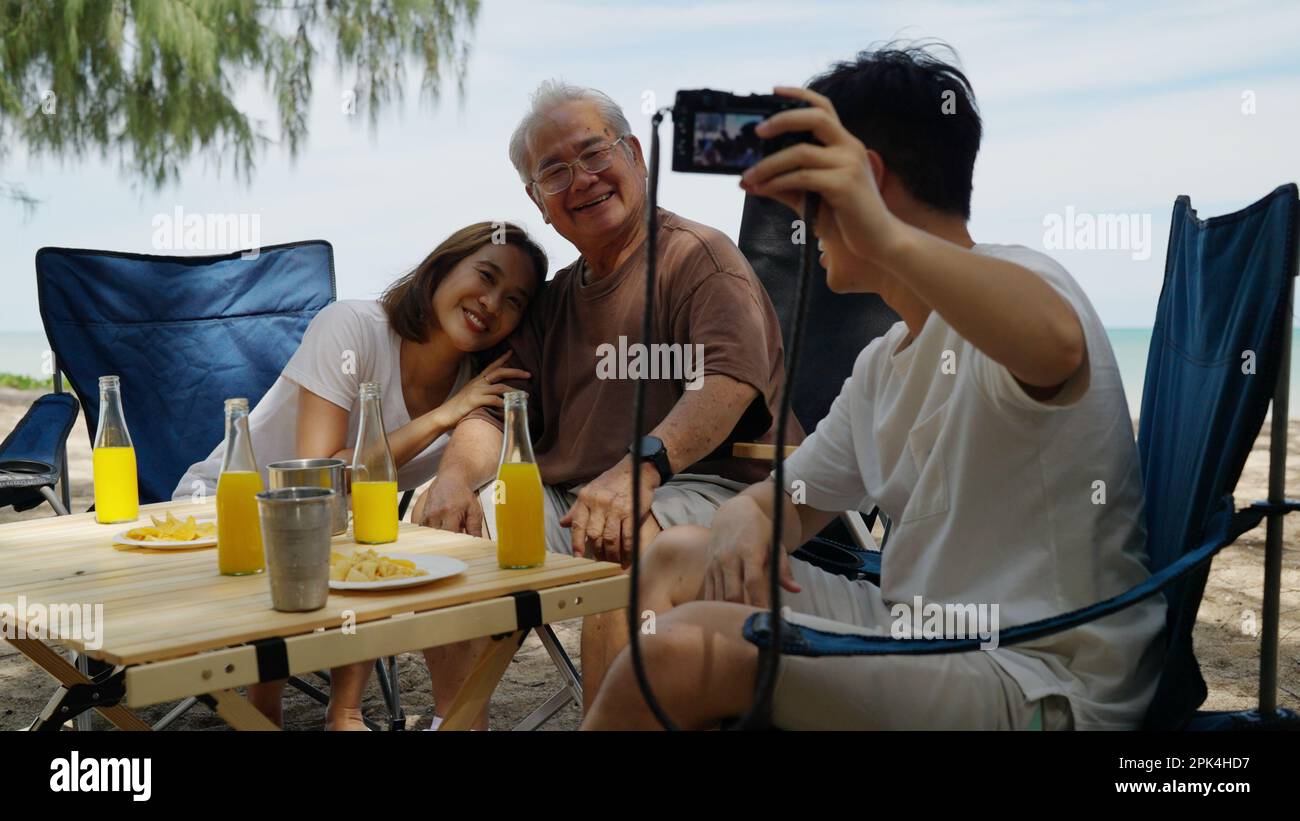 Happy asian family playing at the beach hi-res stock photography and ...