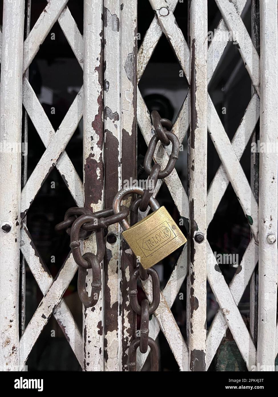 padlock on an old metal fence Stock Photo