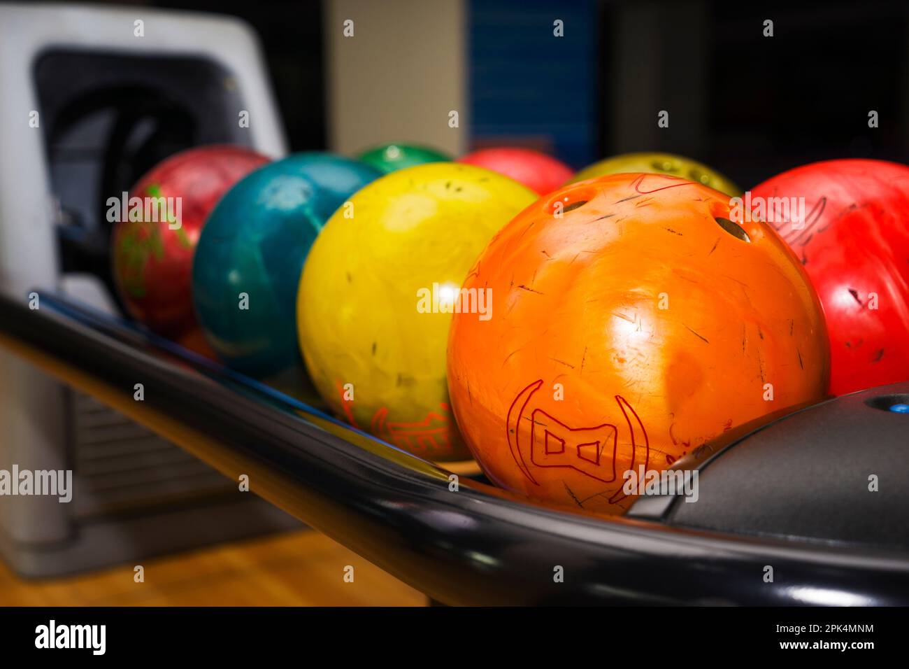 Stand with colorful bowling balls in club no people Stock Photo Alamy