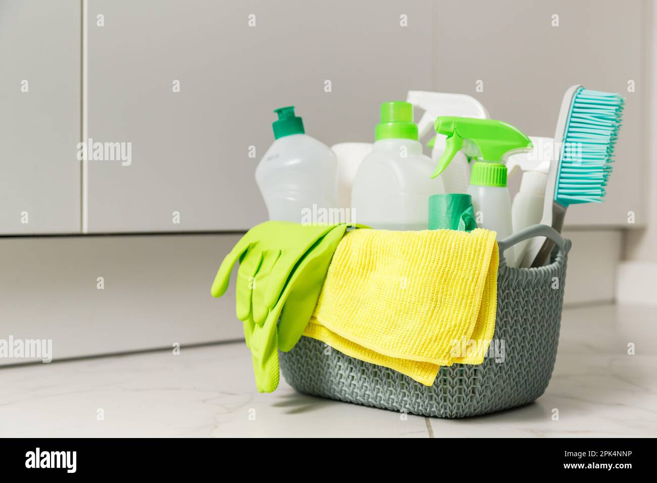 Brushes, sponges, rubber gloves and natural cleaning products in the