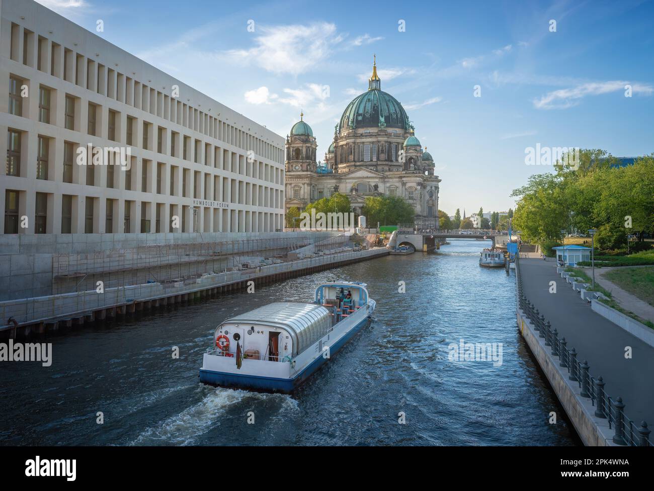 Boat at spree river and Berlin Cathedral - Berlin, Germany Stock Photo