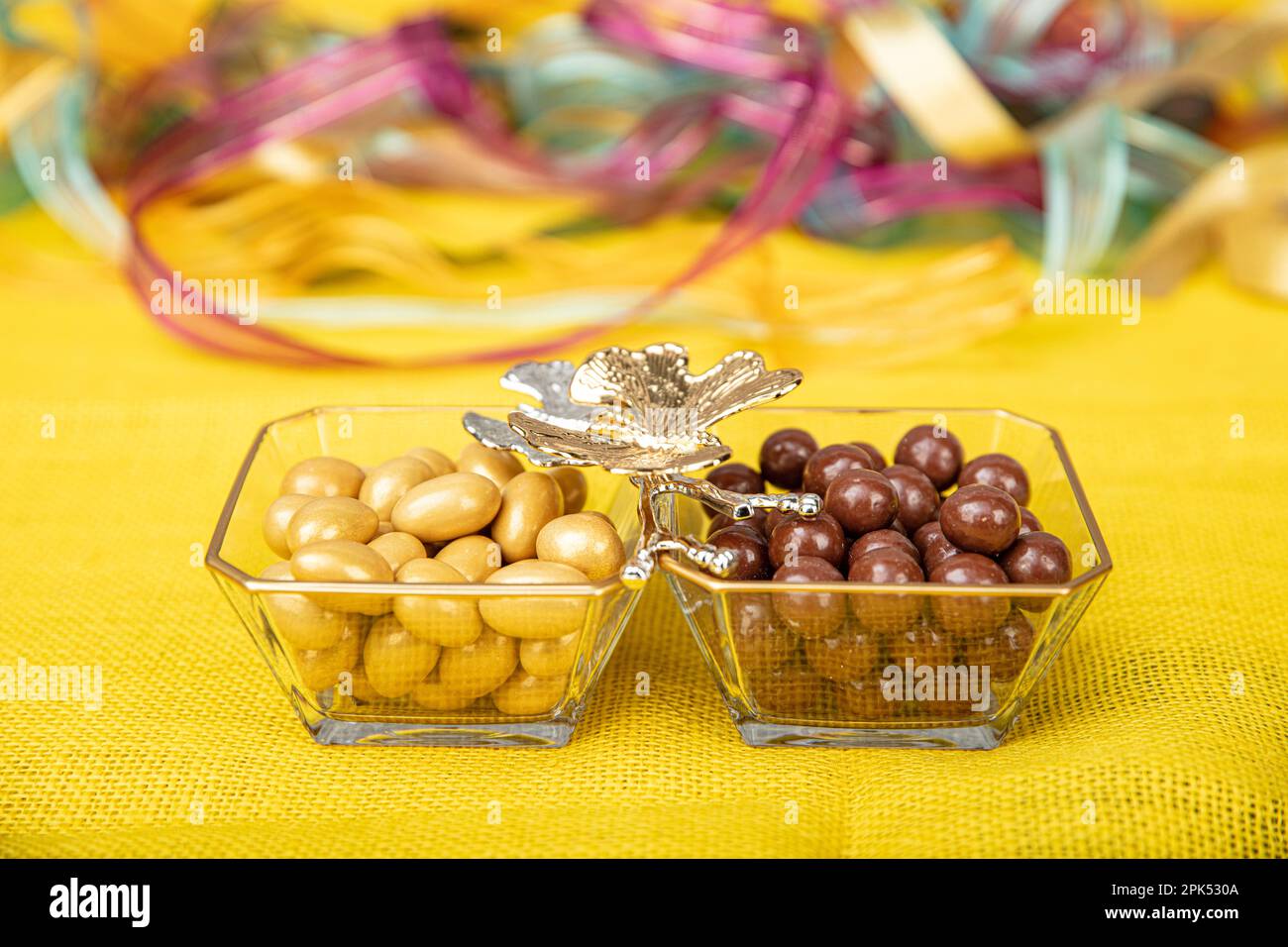 Chocolate coated hazelnut dragee. Dark chocolate covered almonds in a