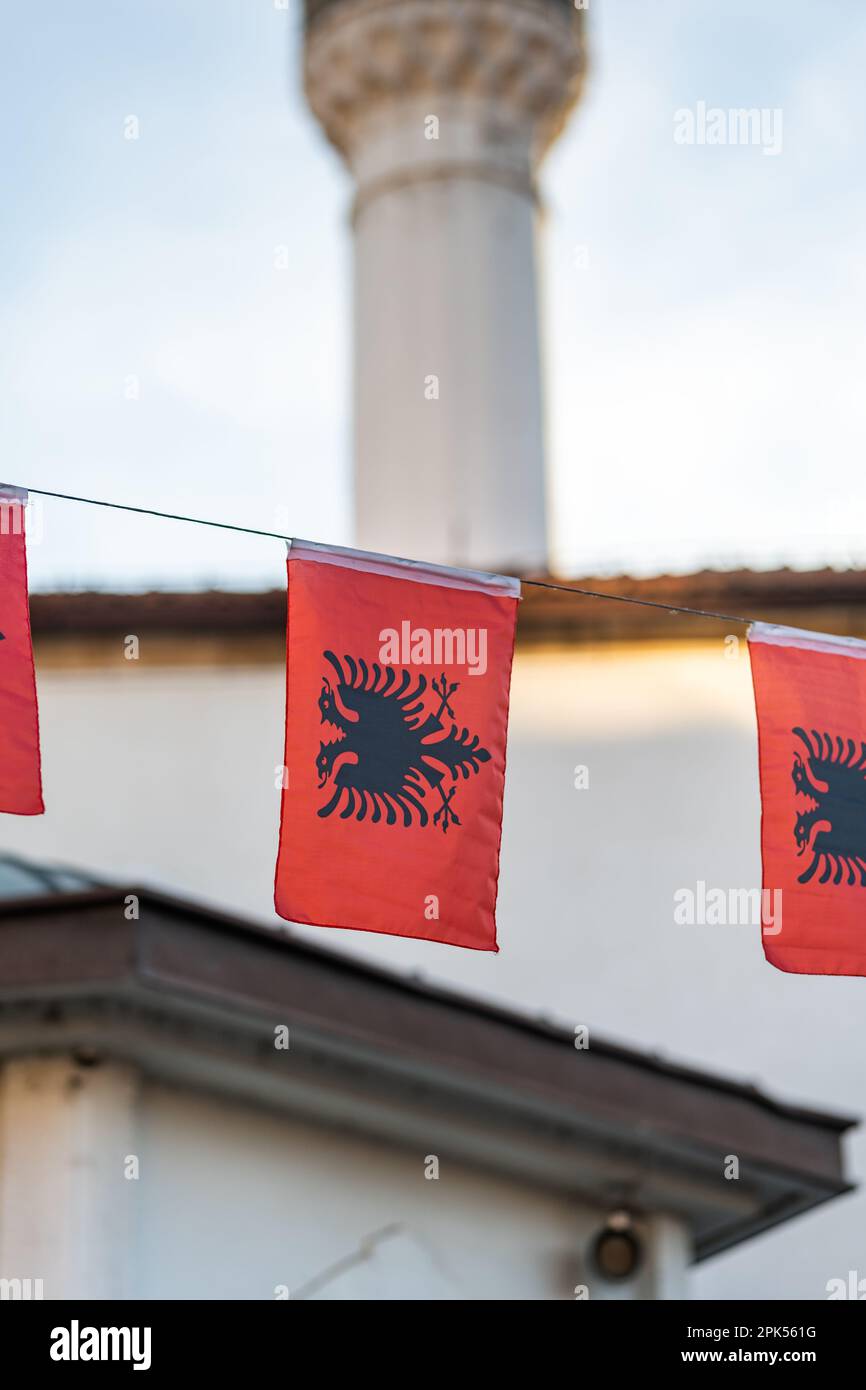 Albanian flag in city, national flag of Albania in street Stock Photo