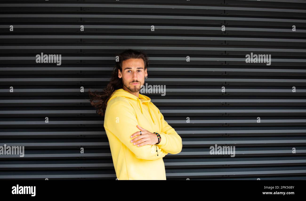Long hair man with backpack hi-res stock photography and images - Alamy