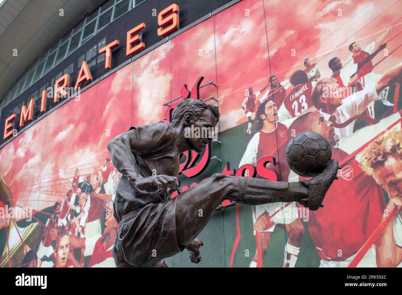 Dennis Bergkamp Statue in front of The Emirates Stadium and  Arsenal Football Club, situated in Holloway, Islington, London. Stock Photo