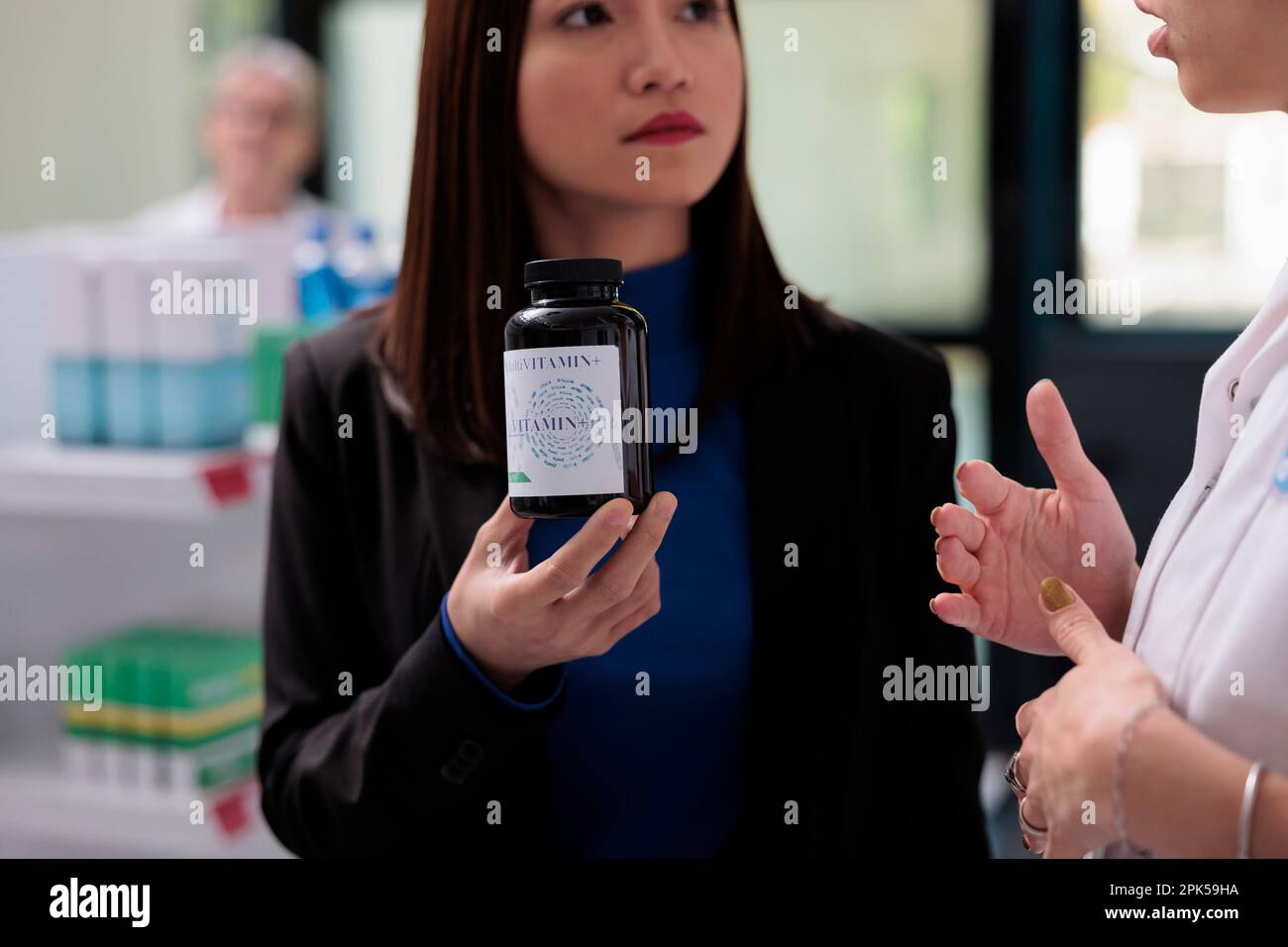 Pharmaceutical consultant explaining customer vitamin and mineral