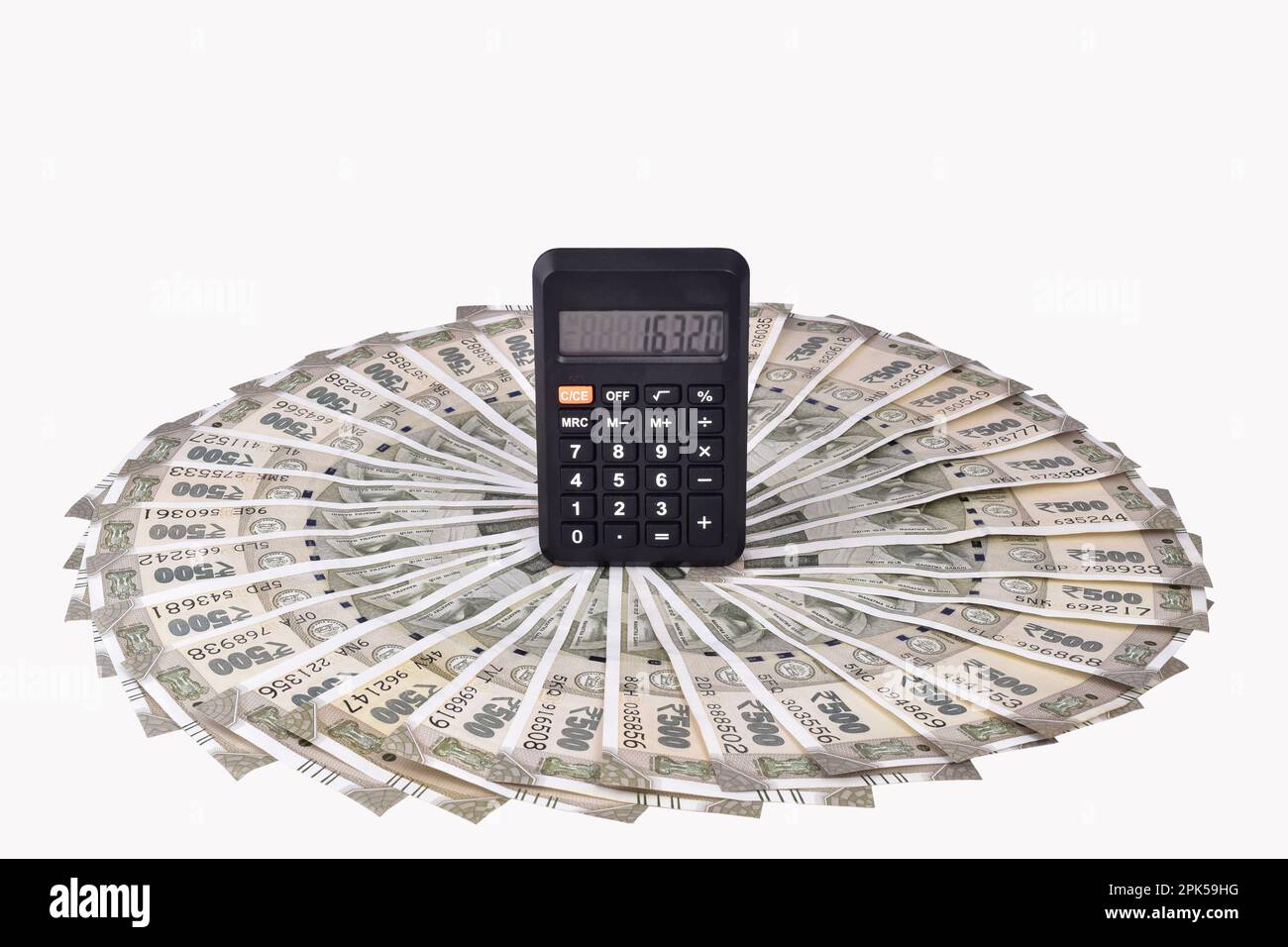 Calculator with indian currency note isolated on white background with ...