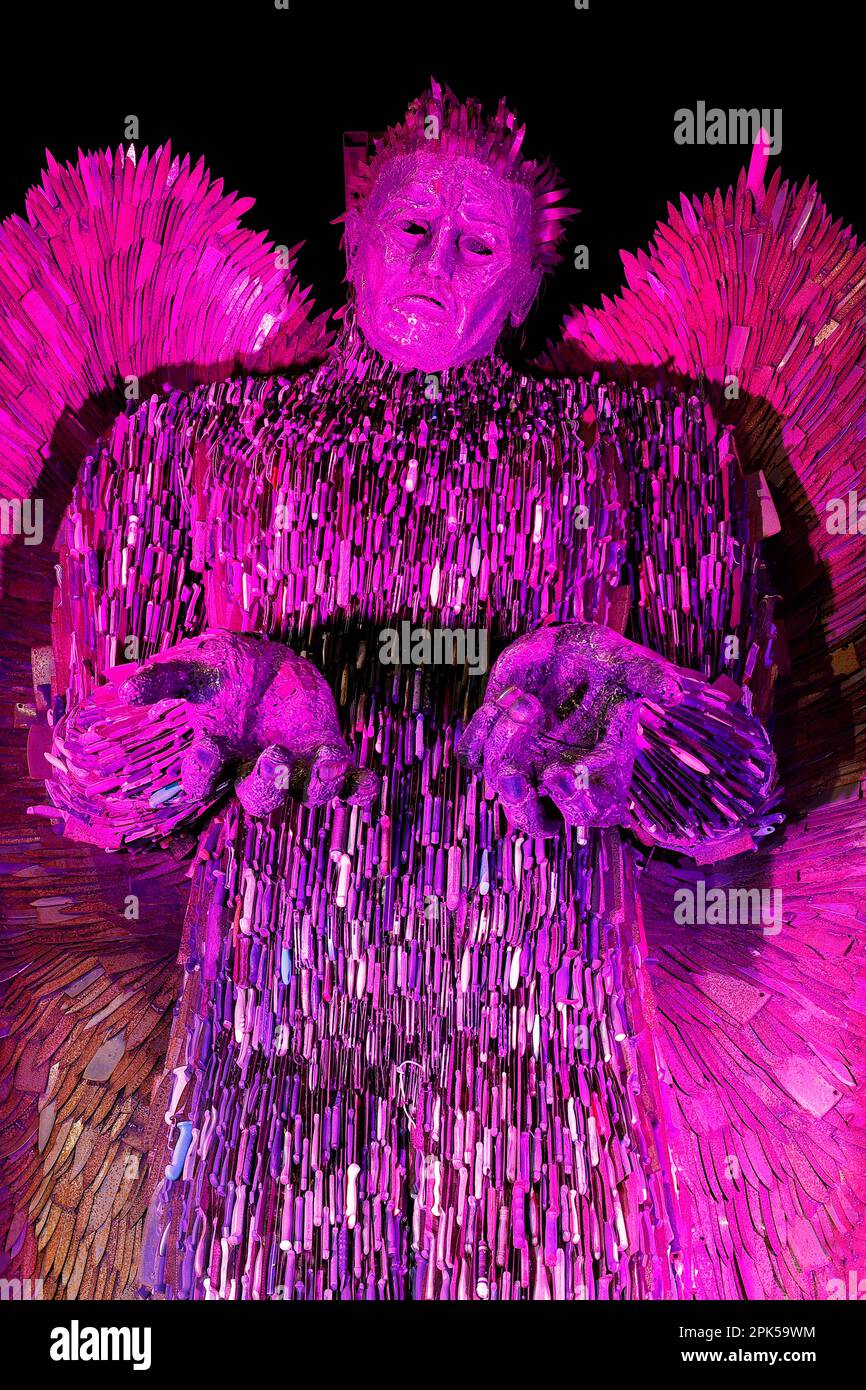 The Knife Angel sculpture illuminated in Purple after been unveiled in