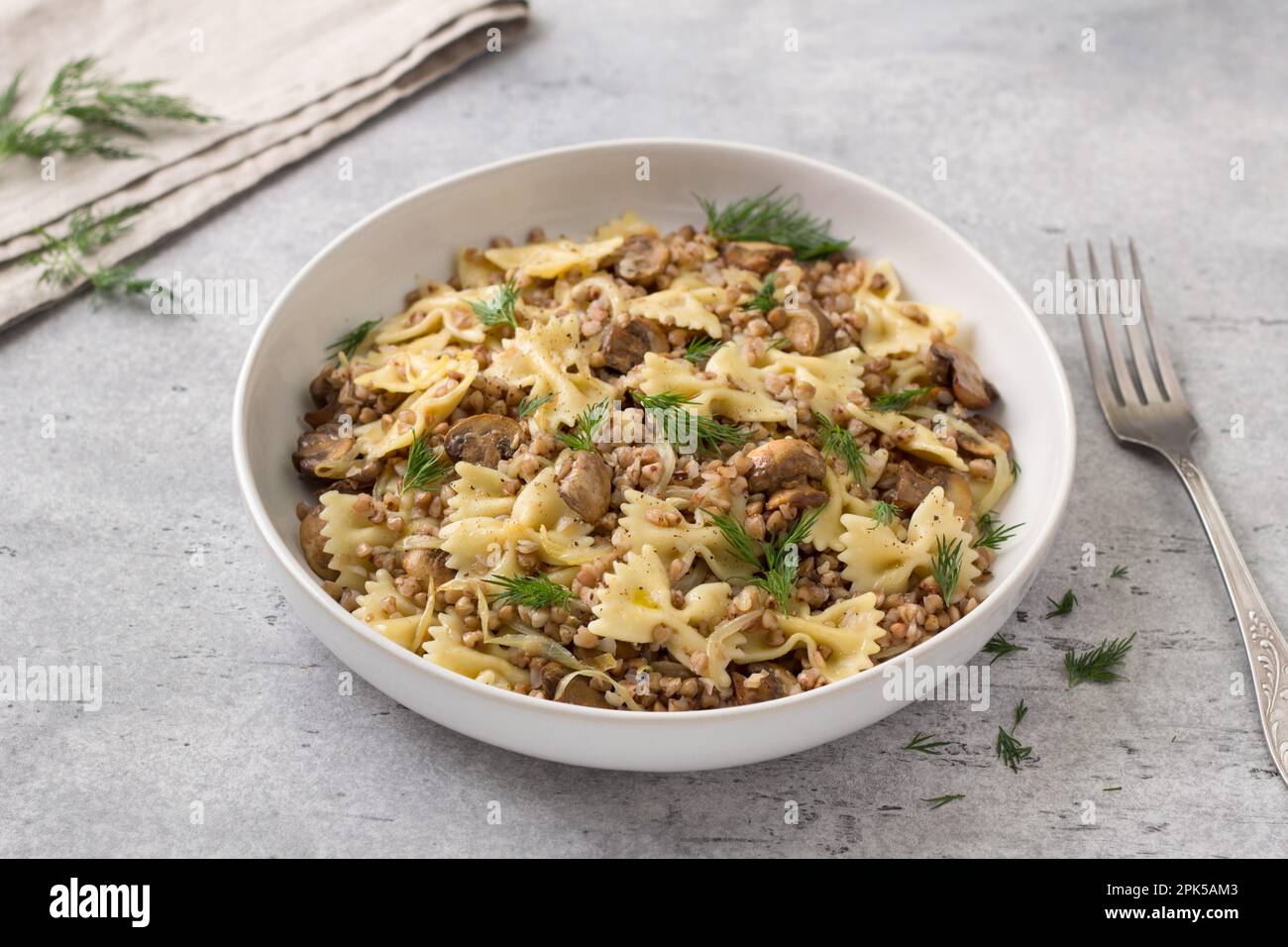 Traditional Jewish dish kasha varnishkes buckwheat, pasta, champignon