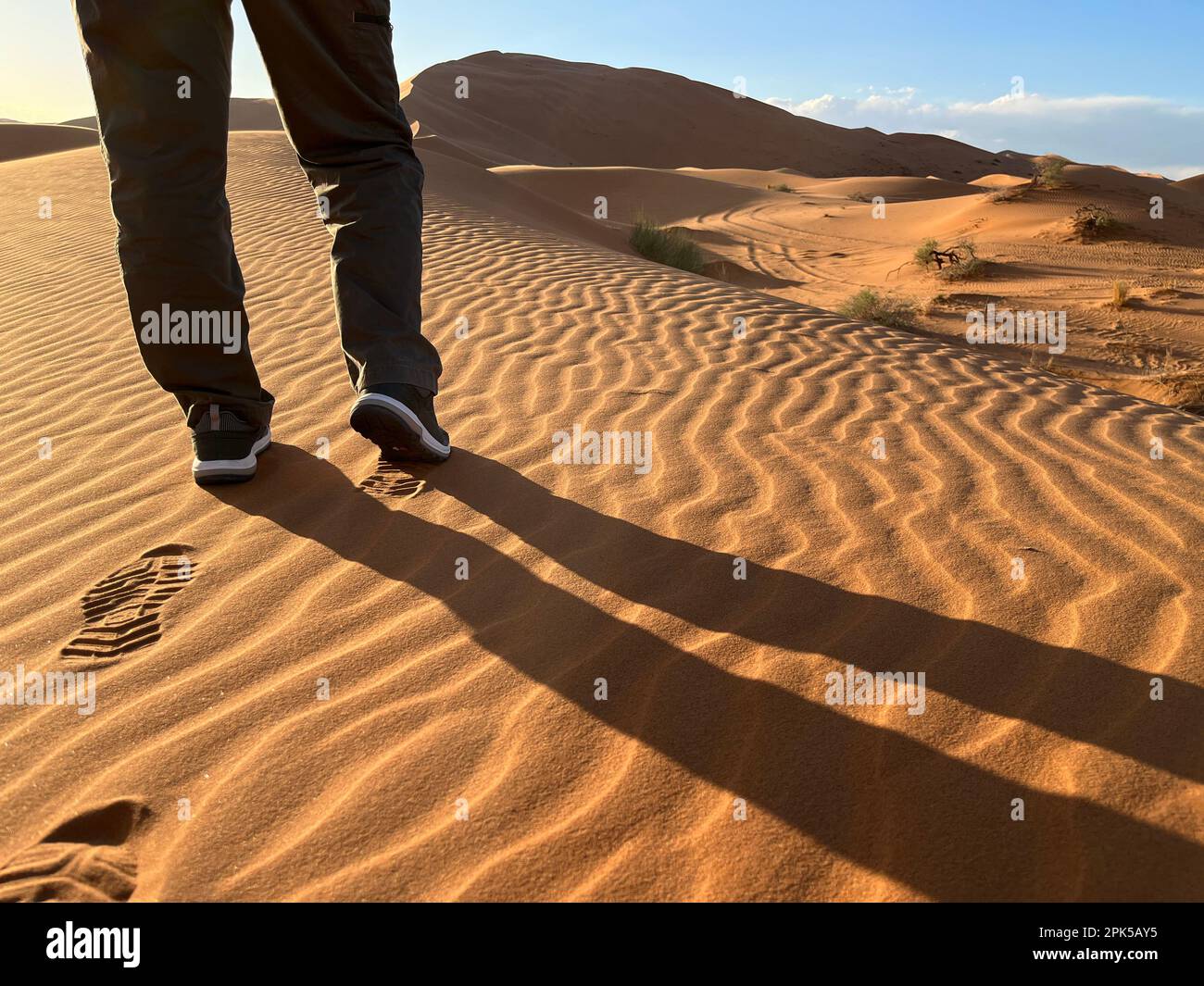 Shoe prints on a sand dune in the Sahara Desert, Merzouga. Grains of ...