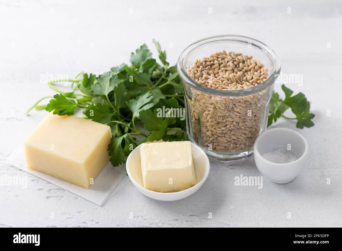 Ingredients for cooking a vegetarian dish pearl barley, cheese