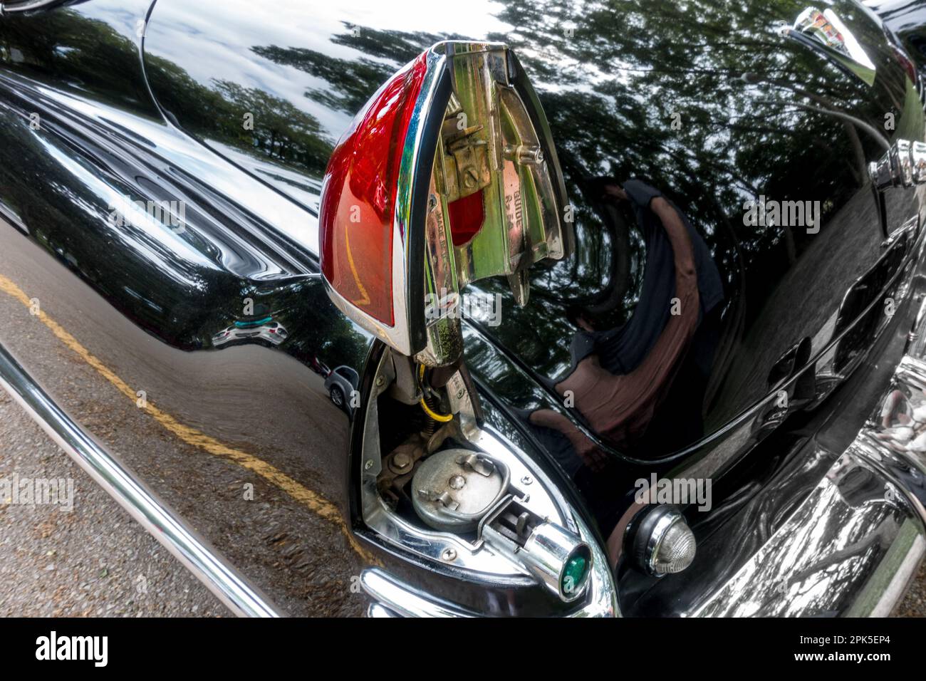 The unusual hidden gasoline fuel cap location placed under a hinged taillight on a 1948 Cadillac convertible. Stock Photo