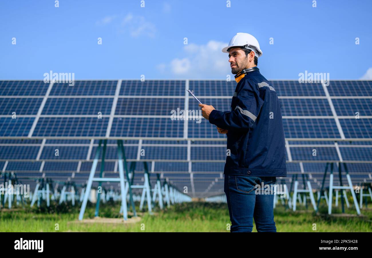 Engineer worker portrait with solar panel at solar farm Stock Photo - Alamy
