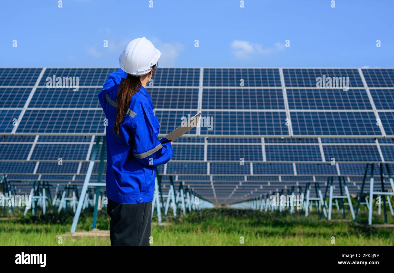 Engineer worker portrait with solar panel at solar farm Stock Photo - Alamy