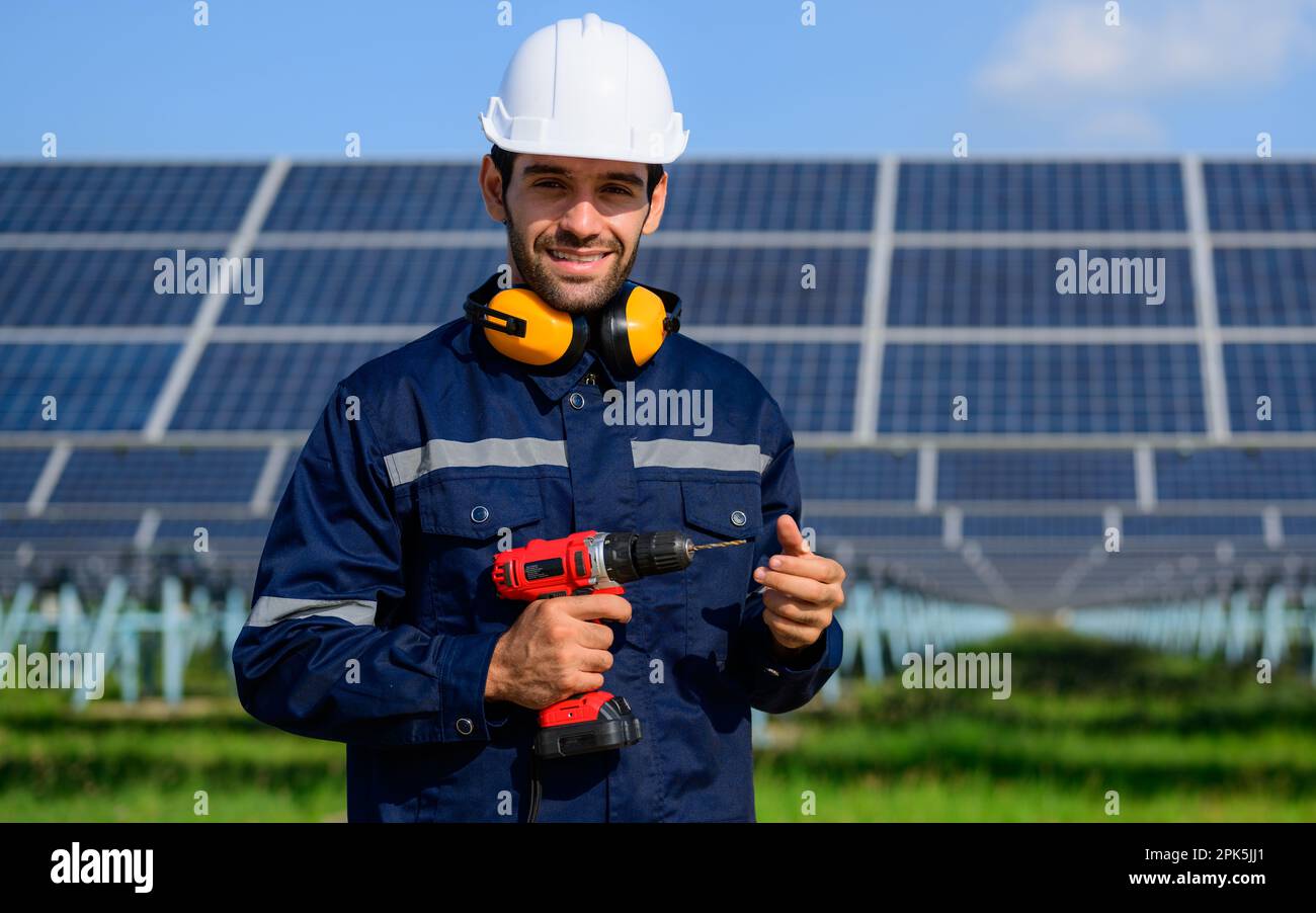 Technician worker installing solar panels at solar cell farm Stock ...