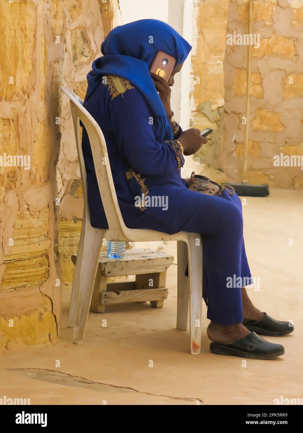 Tunisian Woman Using Cell Phones Stock Photo