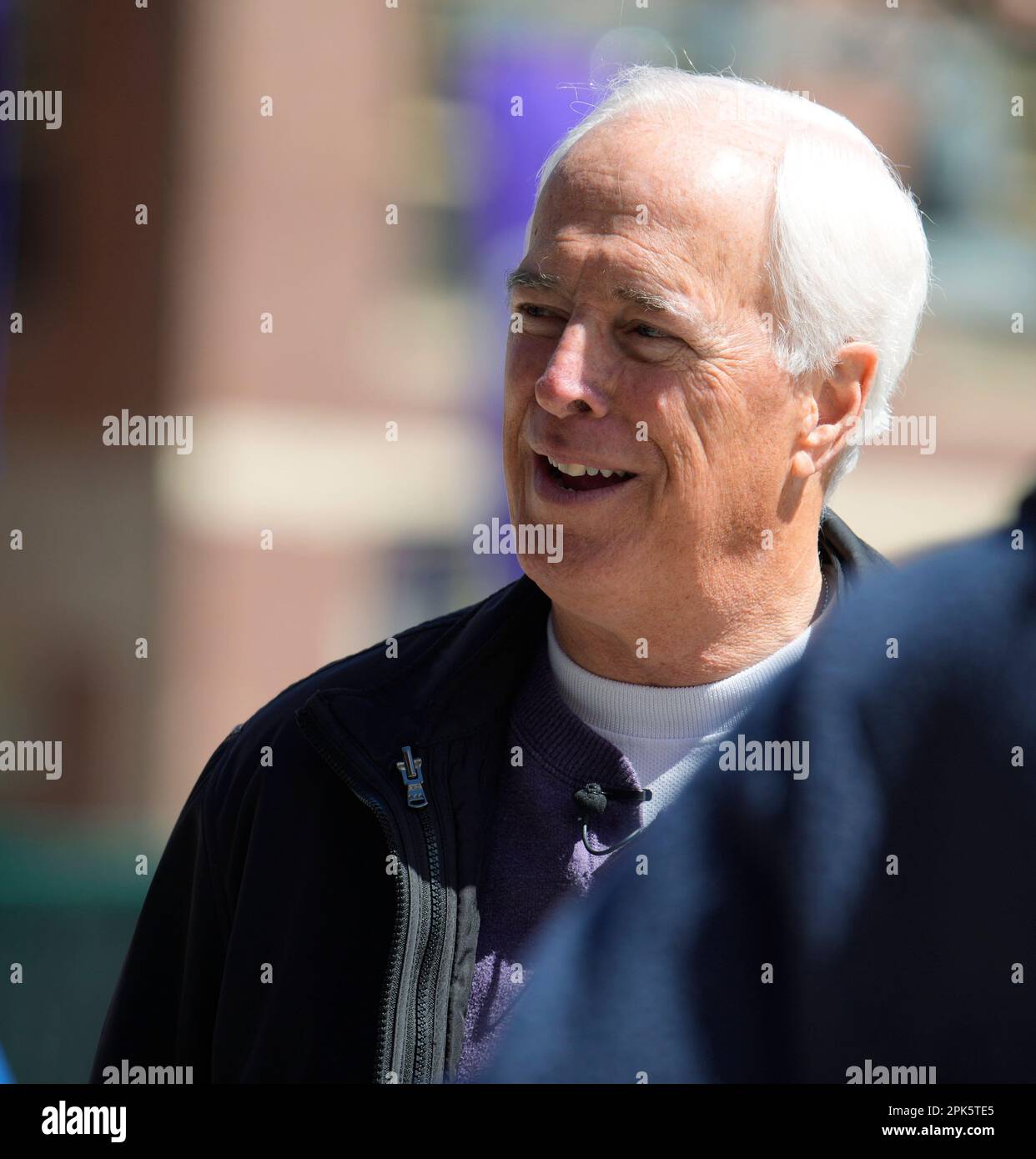 Jack Corrigan, long-tiume radio announcer for the Colorado Rockies, talks about the team's regular-season home opener against the Washington Nationals Wednesday, April 5, 2023, in lower downtown Denver (AP Photo/David Zalubowski) Stock Photo