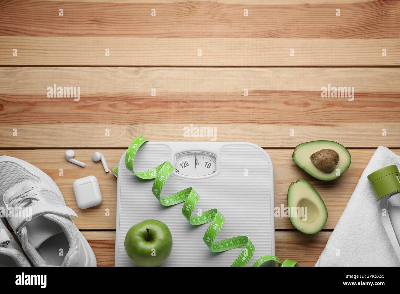 https://c8.alamy.com/comp/2PK5X55/flat-lay-composition-with-bathroom-scale-and-measuring-tape-on-wooden-floor-space-for-text-weight-loss-concept-2PK5X55.jpg