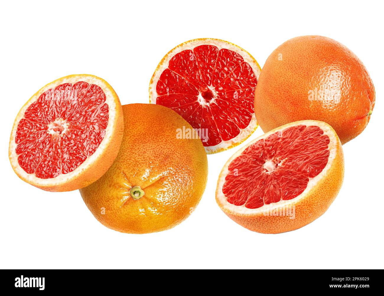 Tasty ripe grapefruits falling on white background Stock Photo