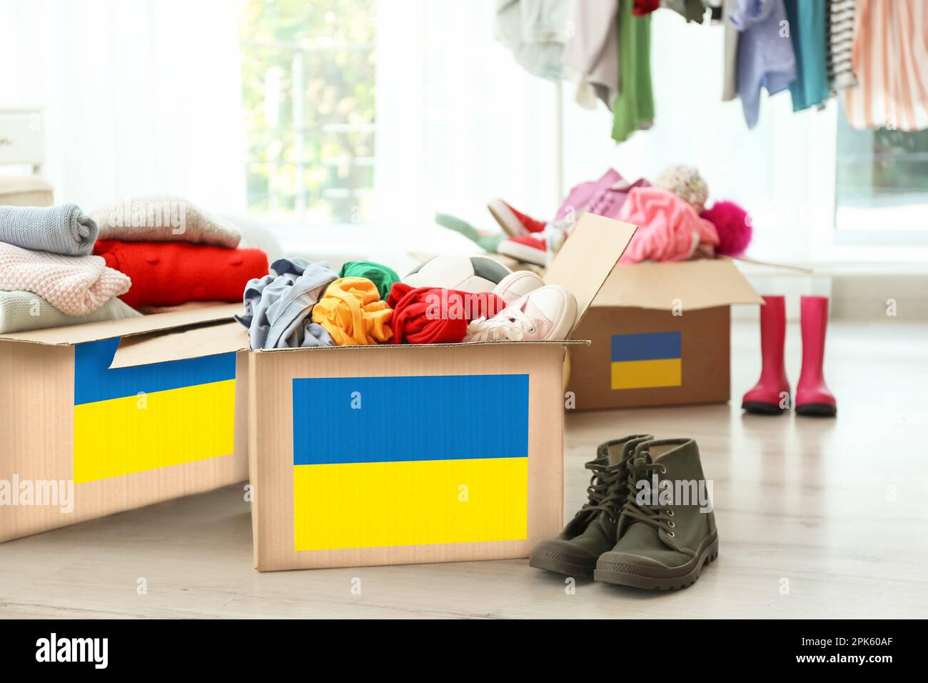 Humanitarian aid for Ukrainian refugees. Donation boxes with clothes on