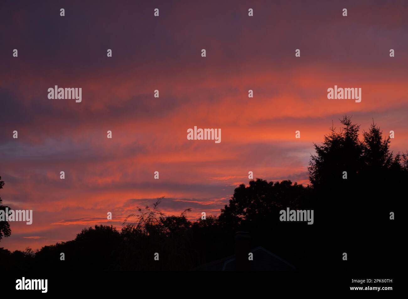 Striated sunset after storm Stock Photo