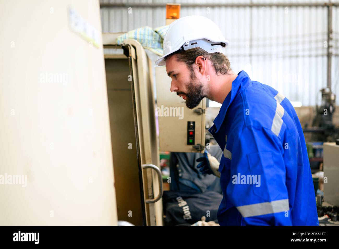 Engineer technician controlling robotic arms on computer laptop Stock Photo
