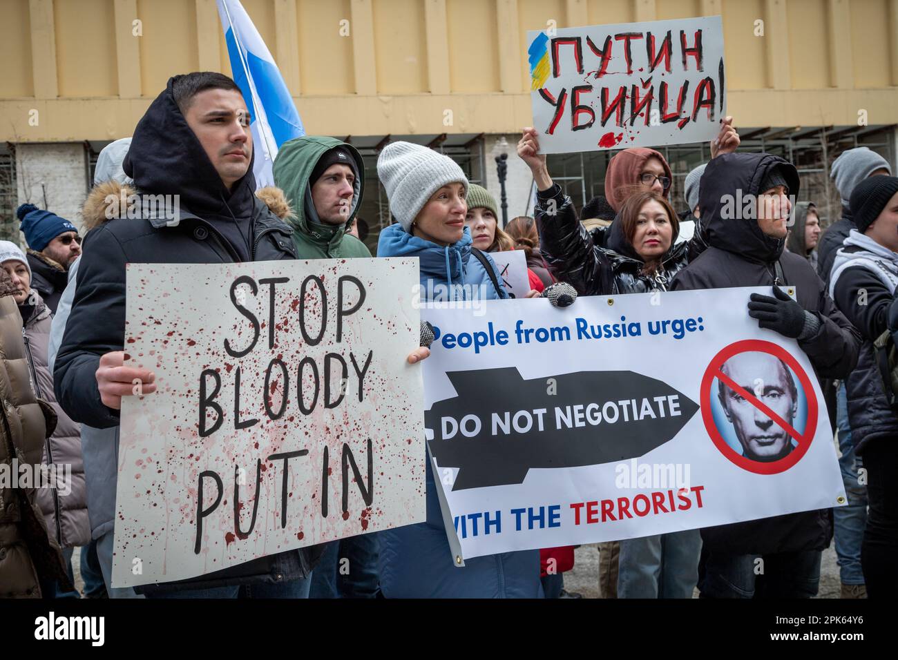 On February 25th, 2023, as Vladimir Putin's invasion of Ukraine passed the one year mark, more than a hundred Chicago area Russians met at noon on Saturday, under the Picasso statue in Daley Plaza to express their deep opposition to the Russian leader and disgust at his brutal incursion. Stock Photo