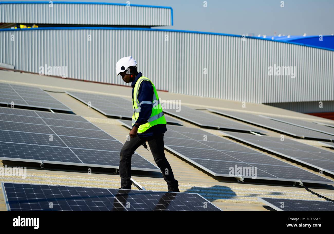 Professional engineer technician operating system at solar cell farm Stock Photo