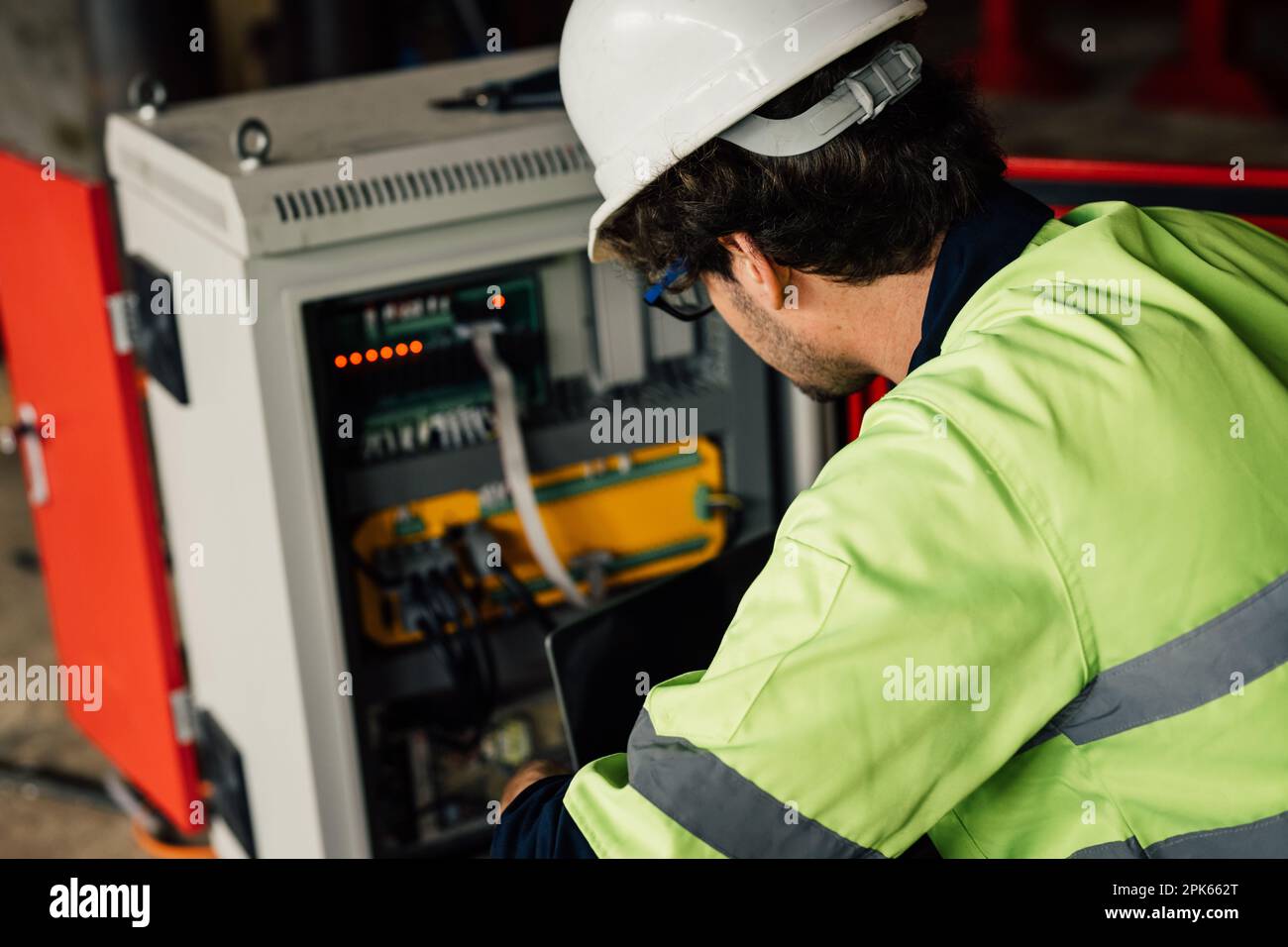 Engineer Reparing Machine Technician engineer checking and repairing automatic robotic machine ...