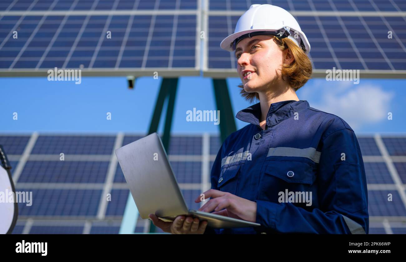 Engineer worker portrait with solar panel at solar farm Stock Photo - Alamy