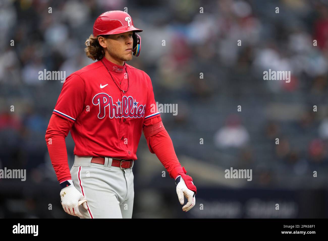 Philadelphia Phillies third baseman Alec Bohm (28) reacts after being hit  by a pitch from New York Yankees relief pitcher Jonathan Loaisiga in the  seventh inning of a baseball game, Wednesday, April