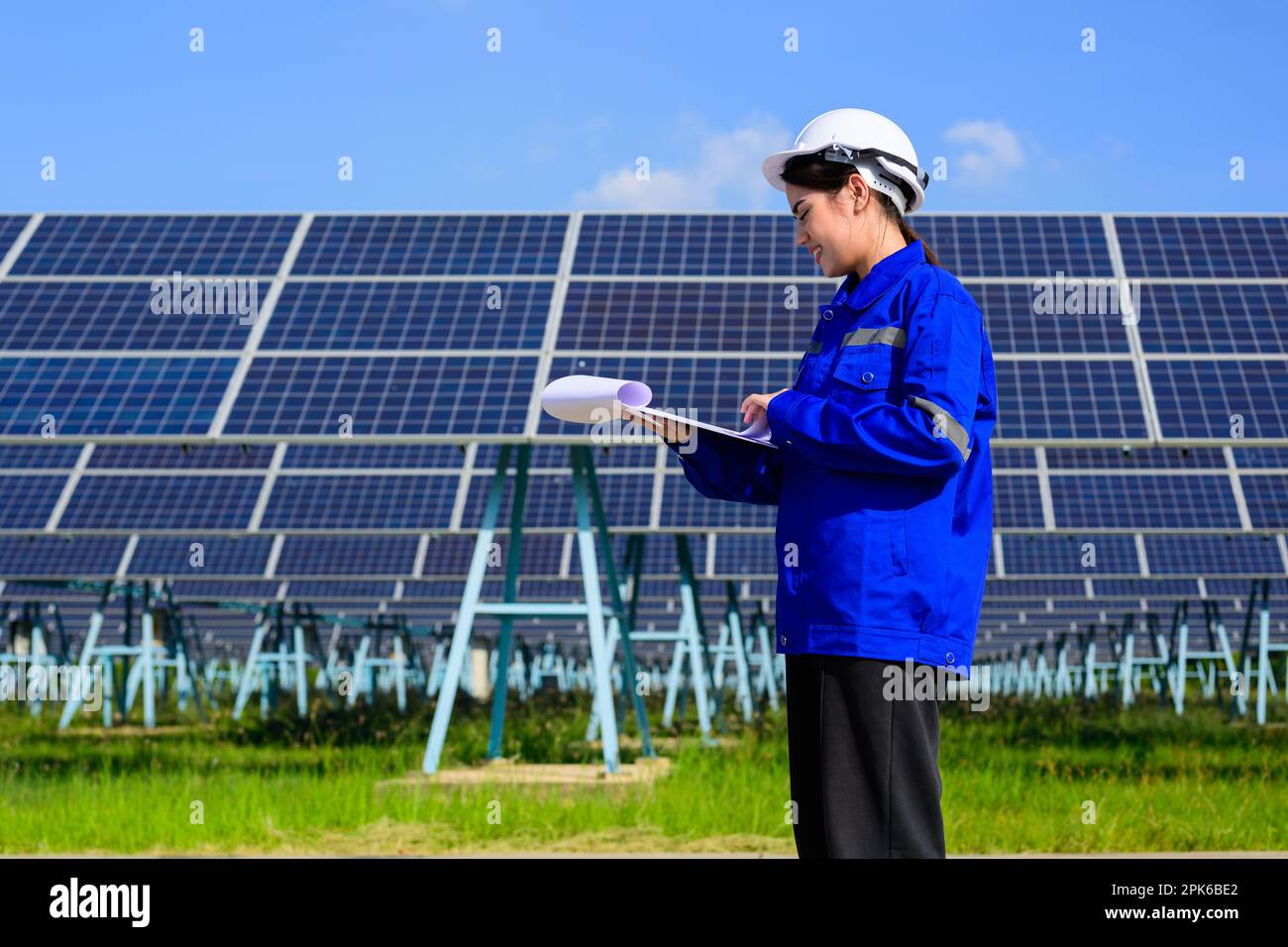 Engineer worker portrait with solar panel at solar farm Stock Photo - Alamy