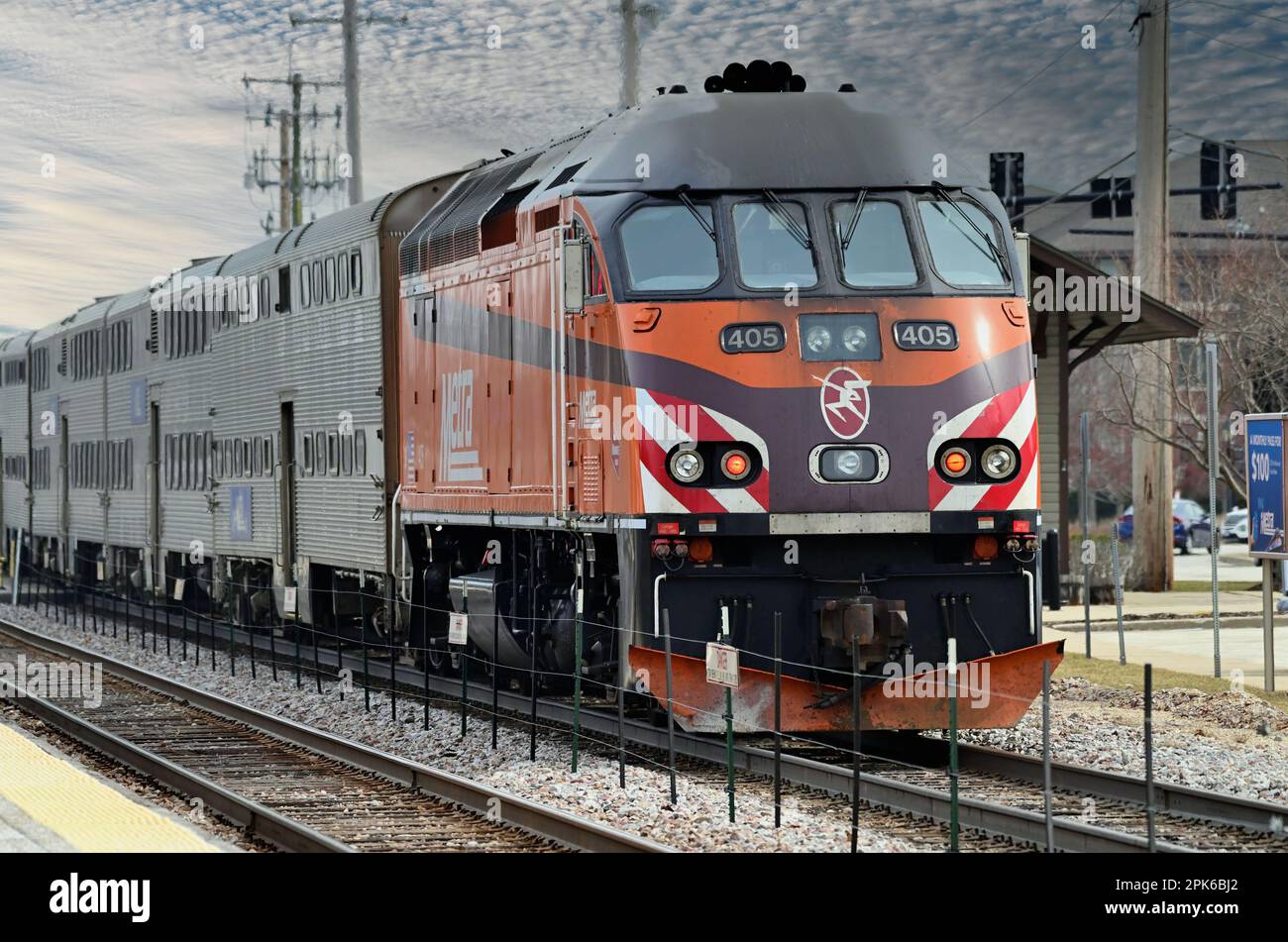 Bartlett, Illinois, USA. A Metra locomotive arriving at the local station with a commuter train on its journey to Chicago. Stock Photo