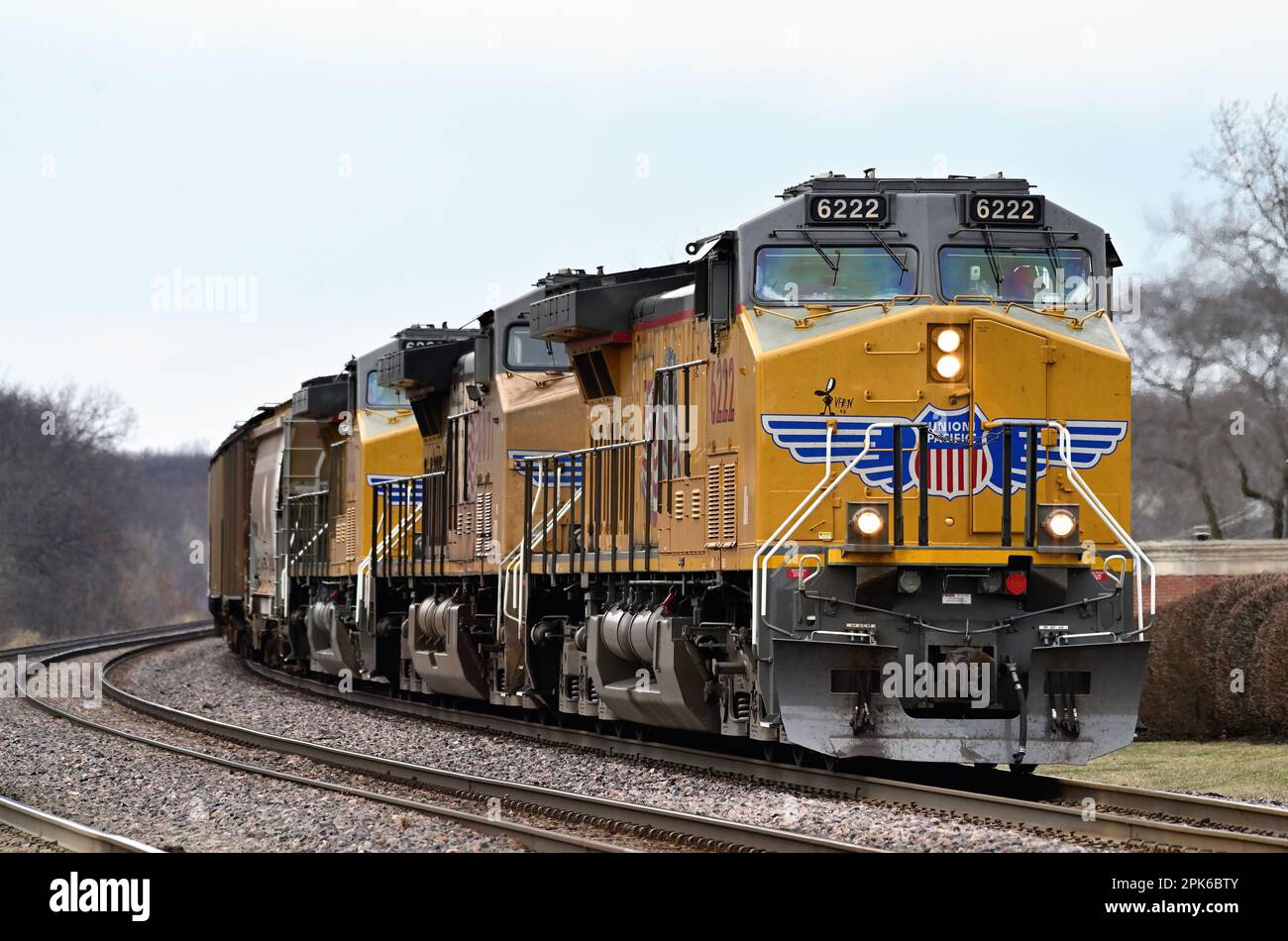 Winfield, Illinois, USA. Locomotives lead a Union Pacific freight train into a curve while traveling through northeastern Illinois. Stock Photo