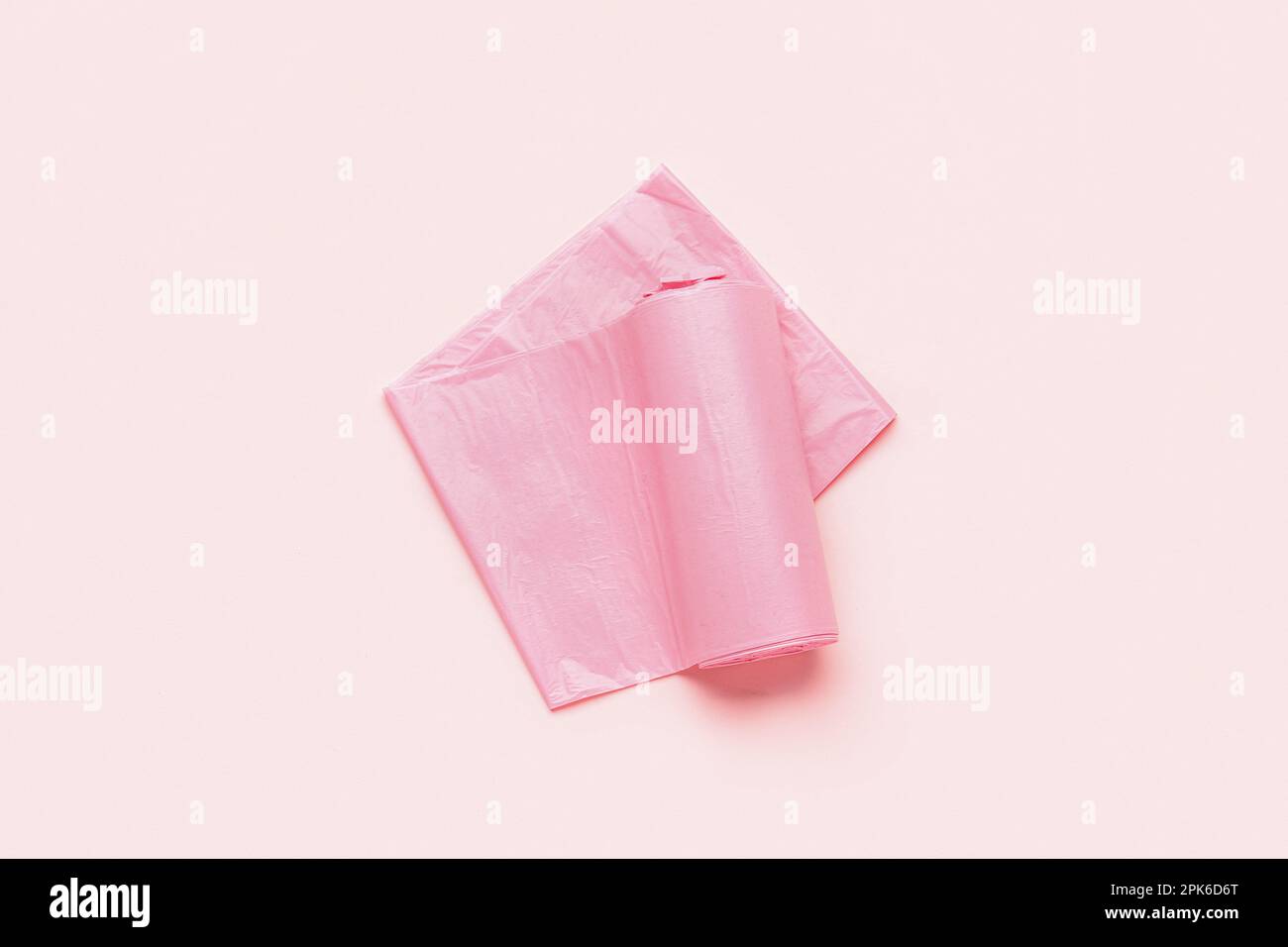 https://c8.alamy.com/comp/2PK6D6T/roll-of-garbage-bags-on-pink-background-2PK6D6T.jpg