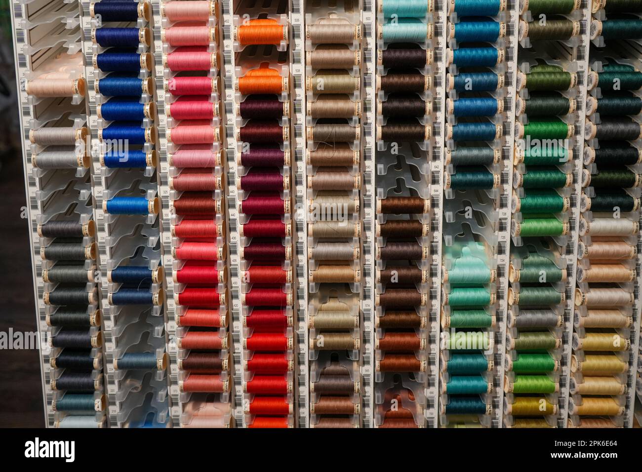 Denver, Colorado, United States - 3.4.2023: colorful thread spools in a local craft store, close up Stock Photo