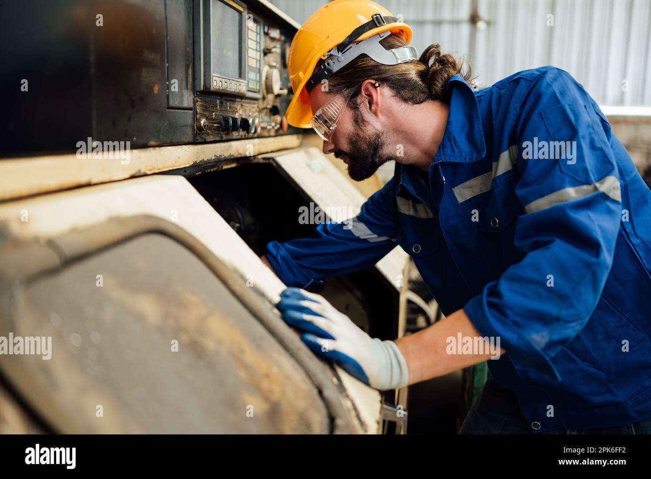 Engineer technician controlling robotic arms on computer laptop Stock Photo