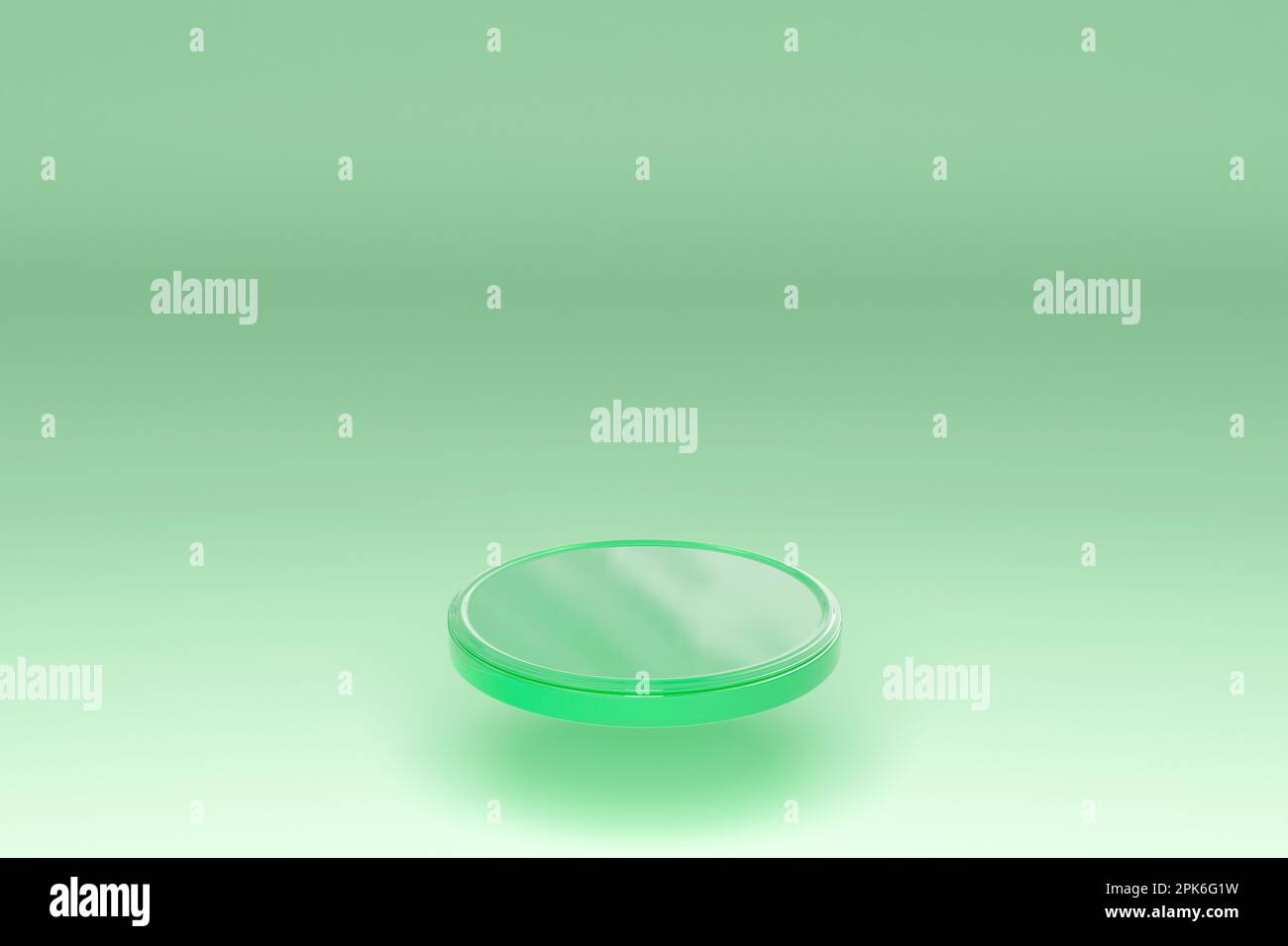 Green glass disk on a light mint background. Minimal scene. A podium for displaying products. 3d rendering Stock Photo