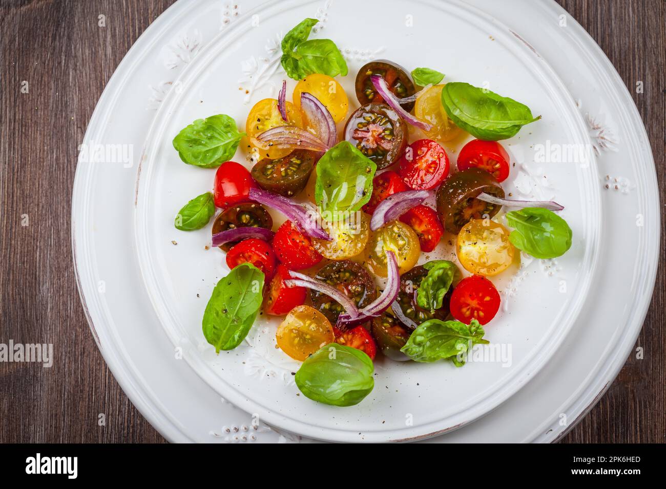 Tomato salad with onions and basil Stock Photo