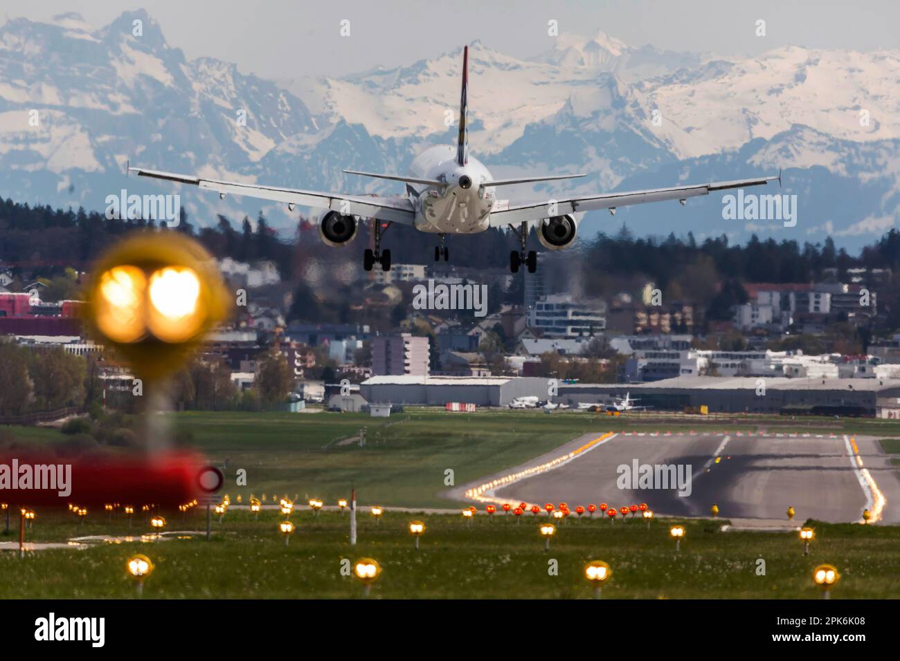 Aircraft on landing, airline Edelweiss Air, Airbus A320-214, snow-covered Alps, ZRH airport, Zurich, Switzerland Stock Photo