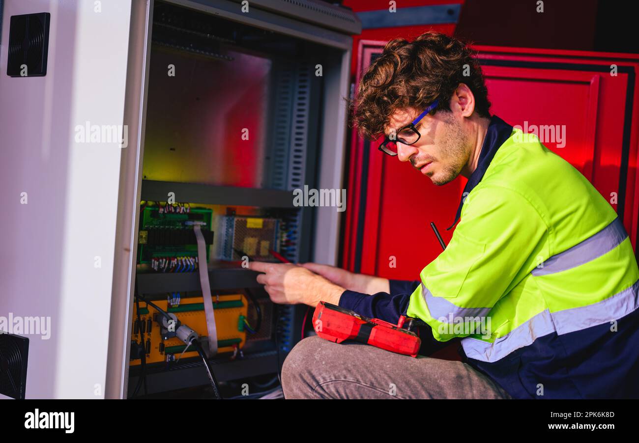 Engineer Reparing Machine Technician engineer checking and repairing automatic robotic machine ...