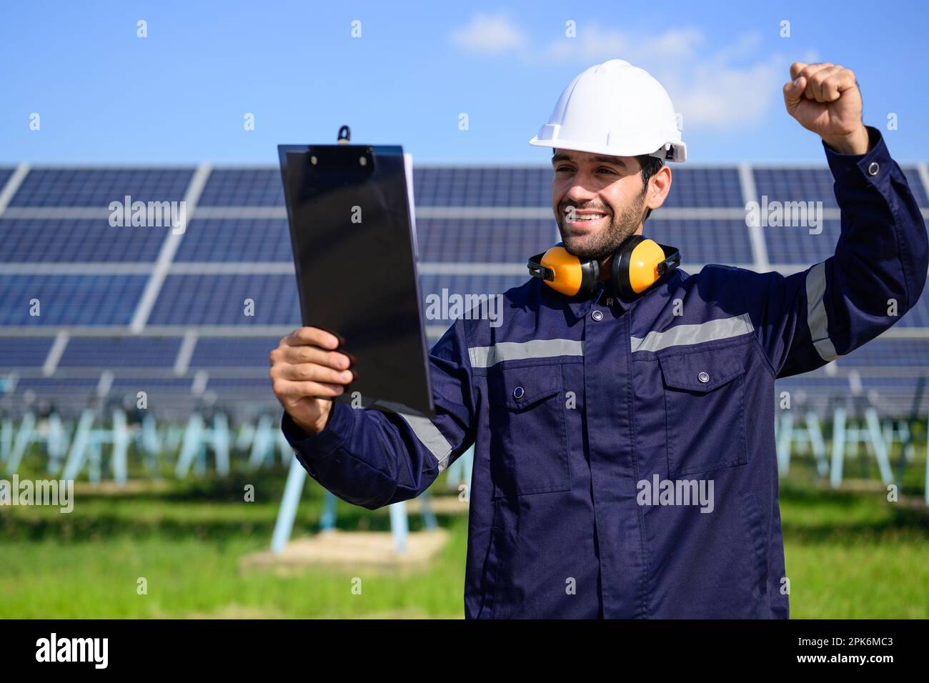 Engineer worker portrait with solar panel at solar farm Stock Photo - Alamy