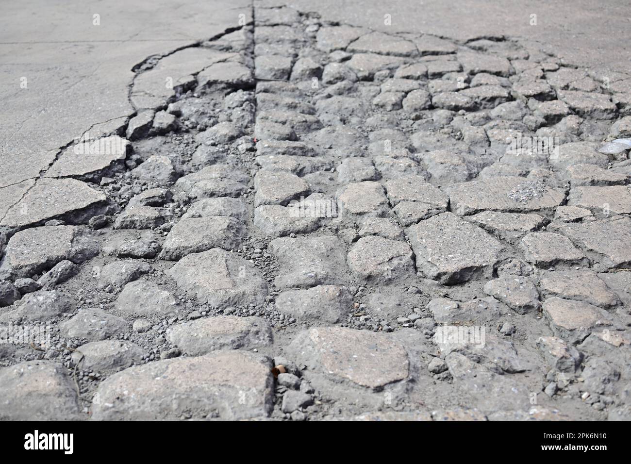 Broken gravel concrete floor, Broken road, Poor condition of road