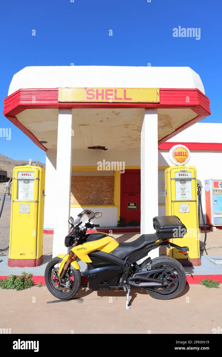 Old Gas Pumps - New Zero Motorcycle Stock Photo