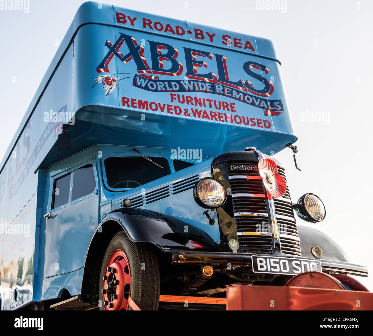 Removal Truck on a Trailer in Brighton Stock Photo