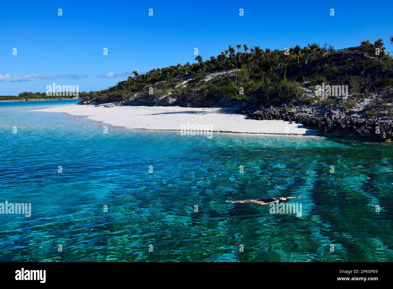 Woman drifting with the current, Driftwood Beach, Shroud Cay, Exuma