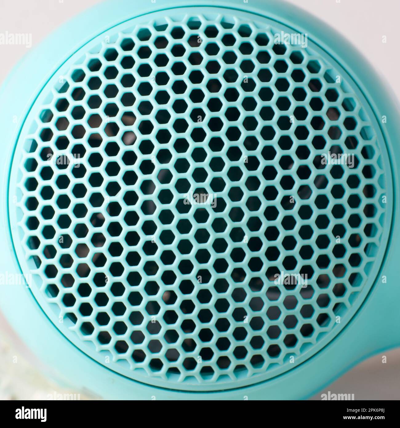 closeup of hair dryer air inlet grille, abstract of plastic molding
